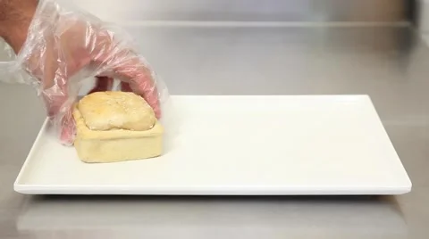Hand putting a chicken pie over a dish Stock Footage 41452052