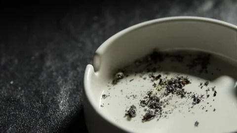 Hand putting the cigarette on an ashtray . Stock Footage 125544602