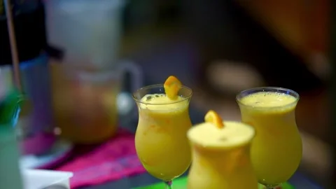 Hand Putting Citrus Slice And Drinking Straw Into Glass With Orange Juice Video Stock Footage 280480416