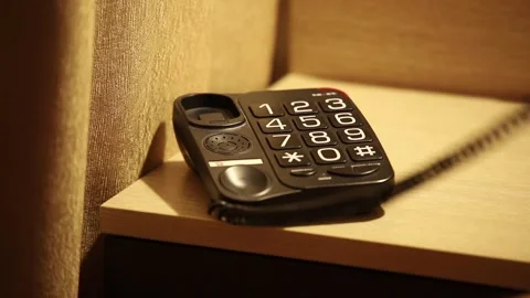 Hand Putting Down push-button phone Stock Footage 297318586