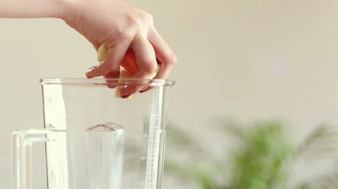 Hand putting food in blender Stock Footage 59540853