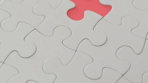 Hand putting missing part of the white puzzle Stock Footage 74751418