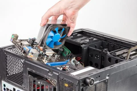 Hand putting in or removing pc internals while maintenance personal computer Stock Photos