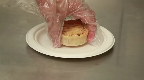 Hand putting a quiche over a dish Stock Footage 41452076