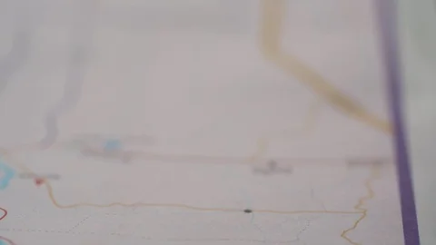 Hand putting red pin to destination on map Stock Footage 122371549