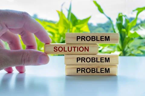 Hand putting Solution text on wooden blocks with other blocks with Problems Foto stock