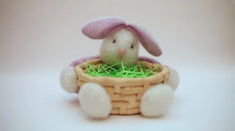 Hand putting three Easter eggs in bunny basket decoration, Easter celebration Stock Footage 35746020