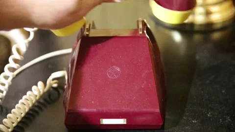 A hand quickly puts down soviet retro phone Stock Footage 168575708