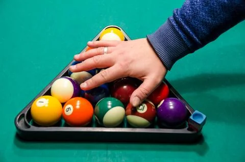 Hand Racking Billiard Balls on Pool Table Stock Photos