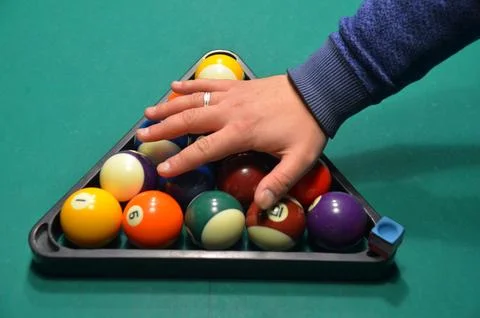 Hand Racking Pool Balls on Billiards Table 스톡 사진