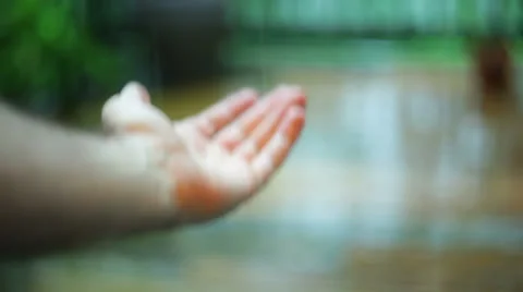 Hand in rain summer 1 Stock Footage