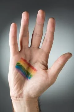 Hand with Rainbow Paint Stock Photos