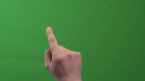 Hand Raising Index Finger While Browsing Invisible Pages On Green Screen Stock Footage 324568811