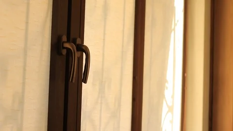 Hand raising roller blinds on windows Stock Footage 87666379