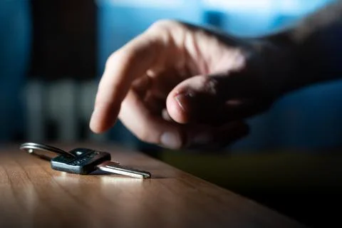 Hand reach a key. Problem solving to overcome obstacles. Home key. Stock Photos