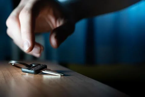 Hand reach a key. Problem solving to overcome obstacles. Home key. Stock Photos