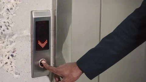 Hand reaches for the button of the elevator call Stock Footage 146550900
