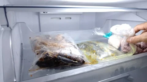 Hand reaches into freezer drawer Stock Footage 332259832