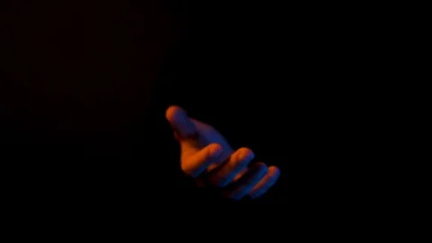 Hand reaches out of Darkness, Dramatic, Orange and Teal, Lighting, Color, Video stock 124540202