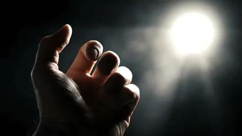 Hand Reaching for a Glowing Orb of Light. Stock Footage 316877809