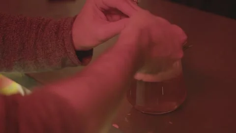 Hand Reaching for Herb-Garnished Cocktail on Bar Counter in Beijing Nightlife Stock Footage 345754726