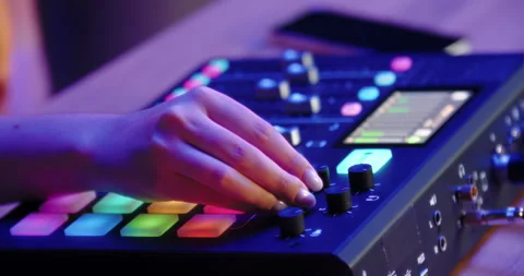 Hand reaching over digital audio mixer Stock Footage 315517415