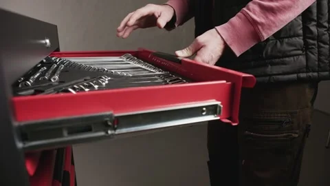 Hand reaching into tool drawer Stock Footage 327783718