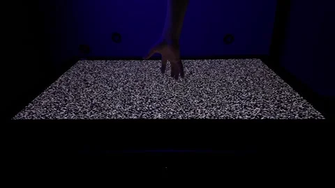 Hand Reaching Toward Television Screen Displaying Static Noise Pattern Stock-Footage 308462243