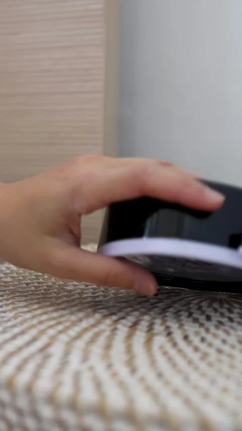 Hand Reaching to Turn Off Alarm Clock on Bedside Table Stock Footage 334652759