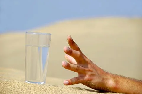 Hand reaching for water. Stock Photos