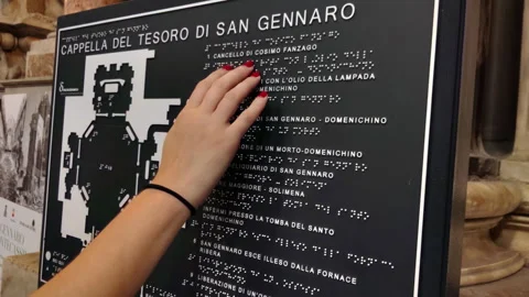 Hand Reading Braille Map of Cappella del Tesoro di San Gennaro, Naples, Italy Stock Footage 314906425
