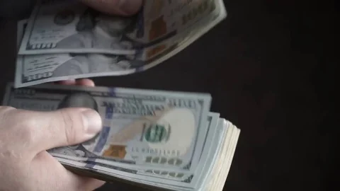 Hand recount dollars. the man counts the money. new hundred-dollar bills Stock Footage 85068016