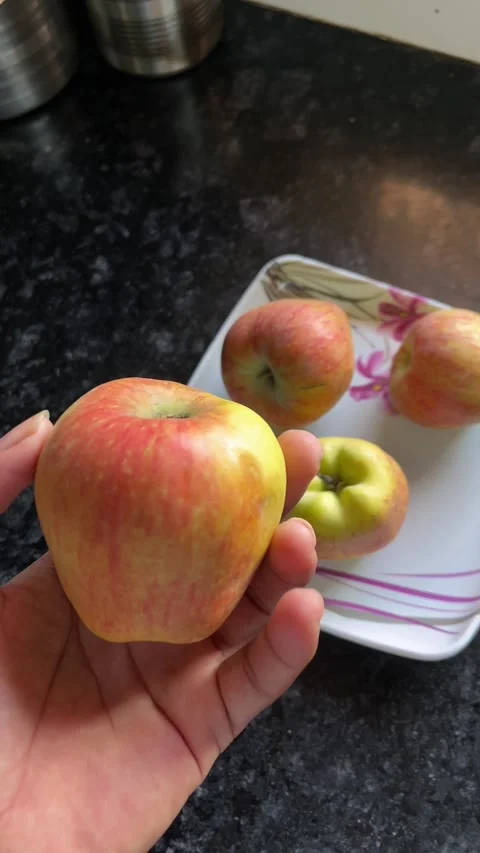 Hand Red Apple Close-Up portrait video Stock Footage 320786501