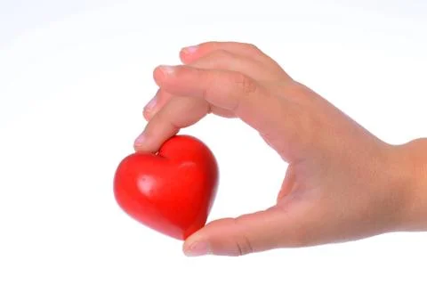 Hand with a red heart Stock Photos