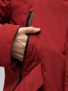 Hand in red jacket pocket close up Stock Photos