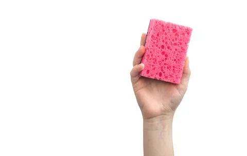 Hand with red kitchen sponge isolated on a white background photo Stock Photos