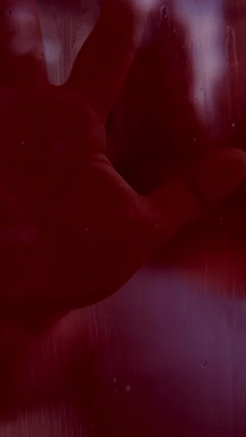 Hand in red light, dramatic horror atmosphere, Ghostly presence behind red .. Stock Footage 315577850