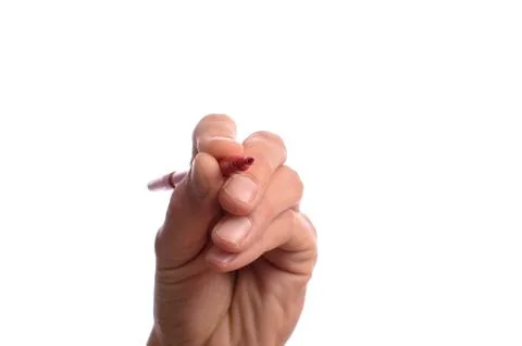 Hand with a red pen Stock Photos
