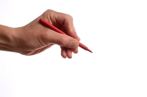 Hand with a red pen Stock Photos