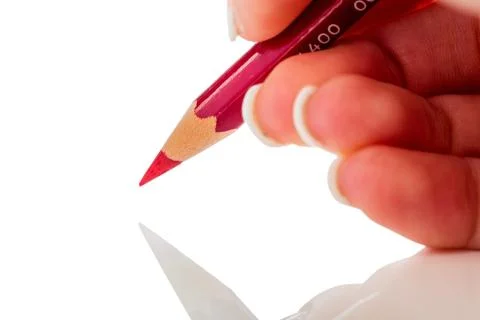 Hand with red pencil Stock Photos