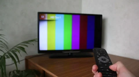Hand with Remote Control Changes Channels TV Stock Footage 42852234