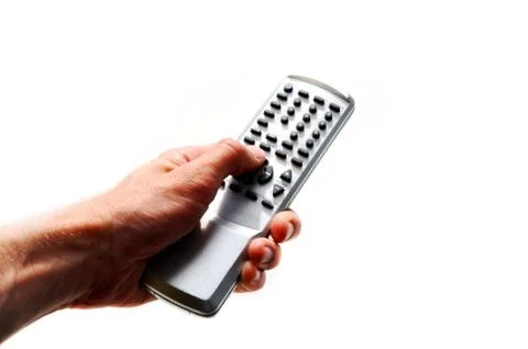 Hand with remote control on the isolated background Stock Photos