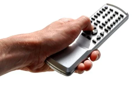 Hand with remote control on the isolated background Stock Photos