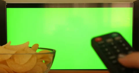 Hand with remote control pointing at modern chroma green screen TV 8 스톡 동영상 129044266