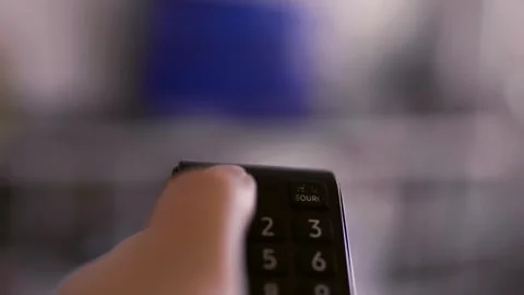 Hand with remote control. Streaming services and watching TV concept.	 Video stock 306957225