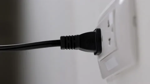 Hand remove Electric plug on socket. Electrical equipment, electrical wires and  Stock Footage 152753975
