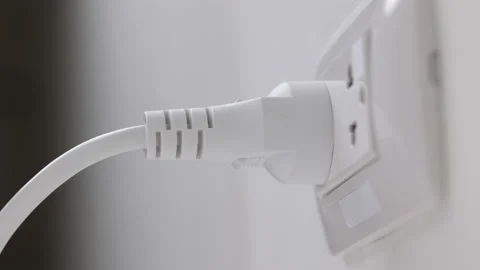Hand remove Electric plug on socket. Electrical equipment, electrical wires and  Stock Footage 152754119