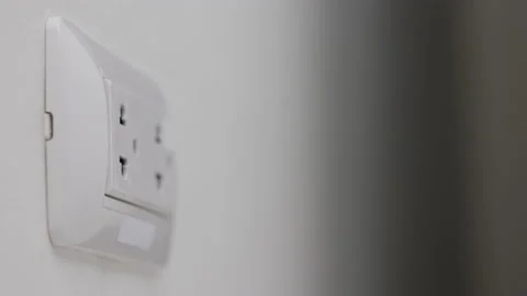 Hand remove Electric plug on socket. Electrical equipment, electrical wires and  Stock Footage 152754409