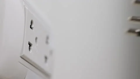 Hand remove Electric plug on socket. Electrical equipment, electrical wires and  Stock Footage 152754969