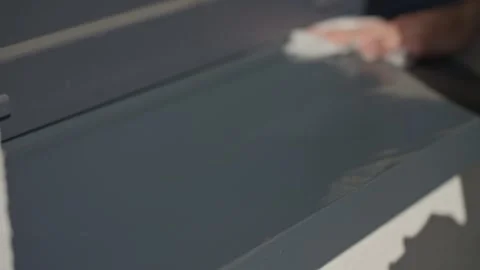 Hand removes dust from surface using cleaning cloth Stock Footage 305345365